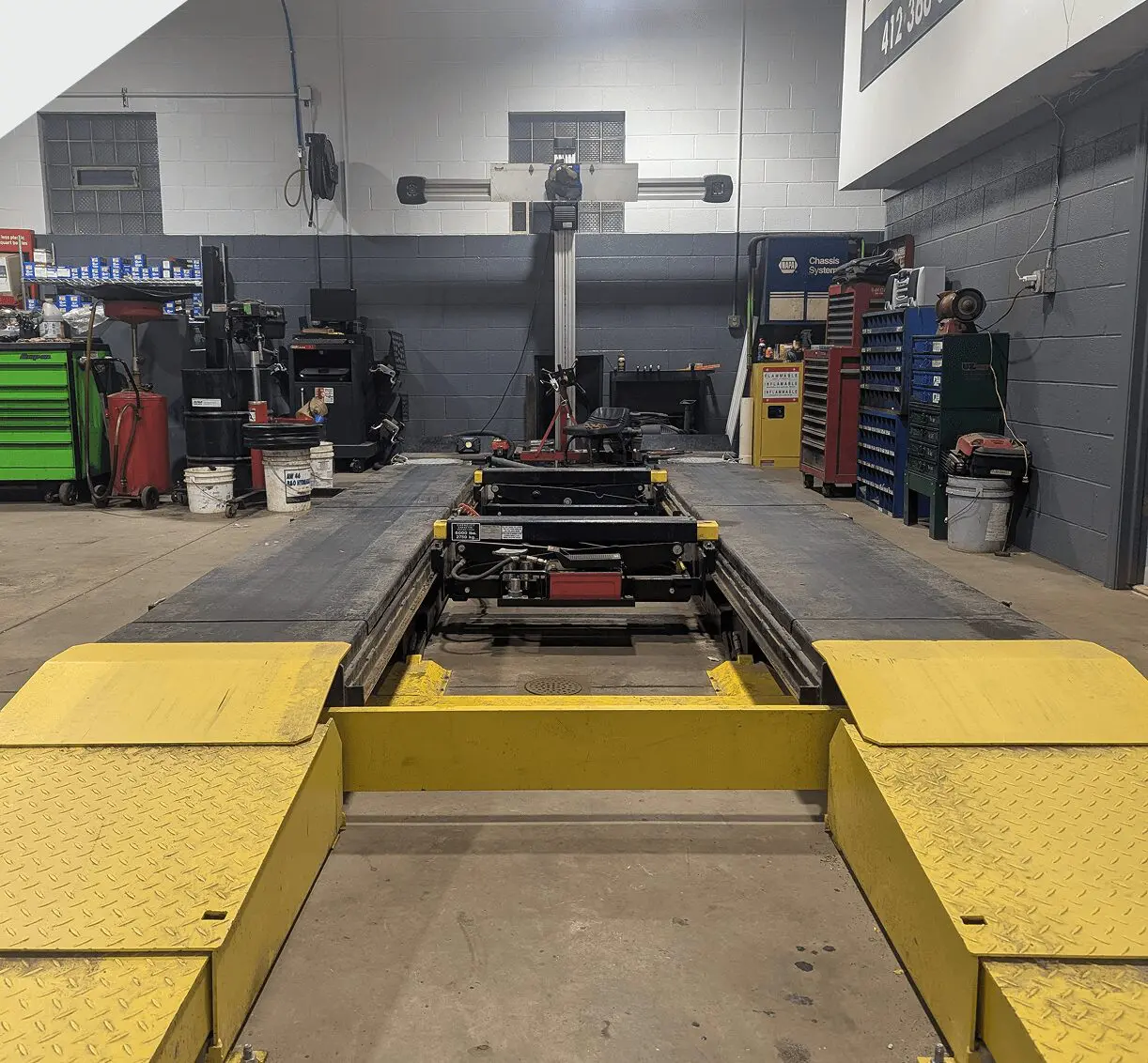 Auto shop vehicle lift and equipment.